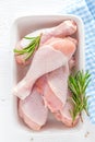 Raw chicken legs, fresh poultry drumsticks on white wooden table Royalty Free Stock Photo