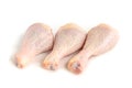 Raw chicken legs on wooden cutting board isolated on white background Royalty Free Stock Photo