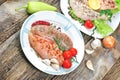 Raw chicken meat - raw chicken breast and raw chicken drumstick with spices on plate, on rustic table Royalty Free Stock Photo