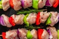 Raw chicken meat pieces with vegetables, pepper and onion on skewers for cooking chicken kebab or bbq Royalty Free Stock Photo