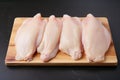 Raw chicken laying on the chopping board