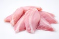 Raw chicken meat and chicken wings laying on white background