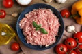 Raw chicken minced meat and ingredients on wooden table, flat lay