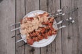 Raw chicken shish kebab with vegetables and spices. Top view. Free space for your text. Rustic style Royalty Free Stock Photo