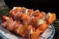 Raw chicken skewers with onions and pepper