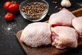 Raw chicken thigh on black background Royalty Free Stock Photo