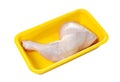 Raw chicken thigh in plastic container isolated on white background with clipping path