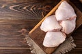 Raw chicken thigh on wooden. Royalty Free Stock Photo