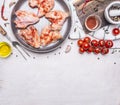 Raw chicken wings in barbecue sauce in the pan, with vegetables and spices wooden rustic background top view close up Royalty Free Stock Photo