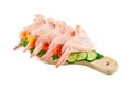 Raw chicken wings on cutting board on white background Royalty Free Stock Photo