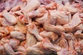 Raw Chicken Wings: Find delectable, uncooked chicken wings at the butcher shop, ideal for preparing flavorful dishes at home Royalty Free Stock Photo