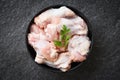 Raw chicken wings with herbs on black plate top view - uncooked chicken meat marinated with ingredients for cooking Royalty Free Stock Photo