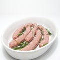 Raw chipolata sausages