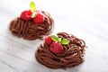Raw chocolate pasta nests with raspberry Royalty Free Stock Photo