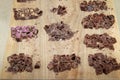 Raw chocolate pieces with nuts. Natural chocolate on wooden background Royalty Free Stock Photo