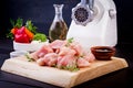 Raw chopped chicken breast fillets on wooden cutting board and meat grinder. Royalty Free Stock Photo
