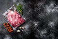 Raw chopped lamb fillet pack, with ingredients and herbs, on black dark stone table background, top view flat lay, with copy space Royalty Free Stock Photo