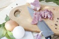 Raw chopped pork tenderloin with herbs in a glass bowl on a wooden board Royalty Free Stock Photo