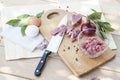 Raw chopped pork tenderloin with herbs in a glass bowl on a wooden board Royalty Free Stock Photo
