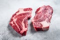 Raw chuck eye roll steaks premium beef meat. White background. Top view Royalty Free Stock Photo