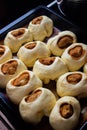 Raw cinnamon buns on a baking sheet Royalty Free Stock Photo