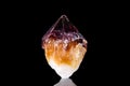 Raw citrine quartz mineral stone in front of black background Royalty Free Stock Photo