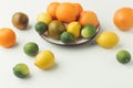 Raw citruses on plate Royalty Free Stock Photo