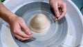 A raw clay pot in the hands of a potter. Workshop in the pottery workshop Royalty Free Stock Photo
