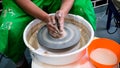 A raw clay pot in the hands of a potter. Workshop in the pottery workshop Royalty Free Stock Photo