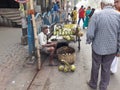 A raw coconut sweet water seller at roadside of the city