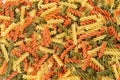 Raw colored pasta fusilli. Uncooked pastas background Royalty Free Stock Photo