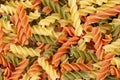 Raw colored pasta fusilli. Uncooked pastas background Royalty Free Stock Photo