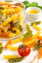Raw colorful italian fusilli pasta and olive oil, selective focus Royalty Free Stock Photo