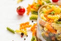 Raw colorful italian fusilli pasta and spices, selective focus Royalty Free Stock Photo