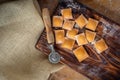 Raw colourful Ravioli with pumpkin and paprika on a wooden Board