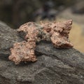 raw copper ore resting on a rock Royalty Free Stock Photo