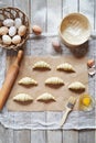 Raw croissants on parchment preparation process Royalty Free Stock Photo