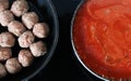 Raw croquettes and gravy pans cooking