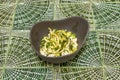 Raw cruciferous vegetable salad in gray bowl