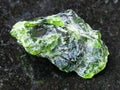 raw crystal of Chrome Diopside gemstone on dark