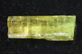 raw crystal of Heliodor (yellow beryl) on dark Royalty Free Stock Photo