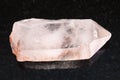 raw crystal of rose quartz gemstone on dark Royalty Free Stock Photo