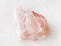 raw crystal of rose quartz gemstone on white Royalty Free Stock Photo