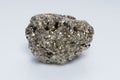 Raw crystalline pyrite iron pyrite, fool's gold . Mineral pyrite from the group of sulfides. The mineral pyrite on a