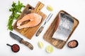 Raw cut salmon fish, on white stone table background, top view flat lay Royalty Free Stock Photo