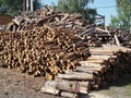 Raw de-barked pine wood logs in a lumber staging and storage yard - Western Oregon. Raw timber stacked and ready to begin to be Royalty Free Stock Photo