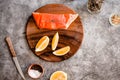 Delicious portion of fresh salmon fillet with aromatic herbs, spices and vegetables - healthy food, diet or cooking concept Royalty Free Stock Photo