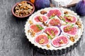 Raw delicious tart with fresh figs and goat cheese on rustic wo Royalty Free Stock Photo