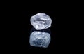 Raw diamond isolated on black background. Royalty Free Stock Photo