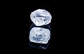 Raw diamond isolated on black background. Royalty Free Stock Photo